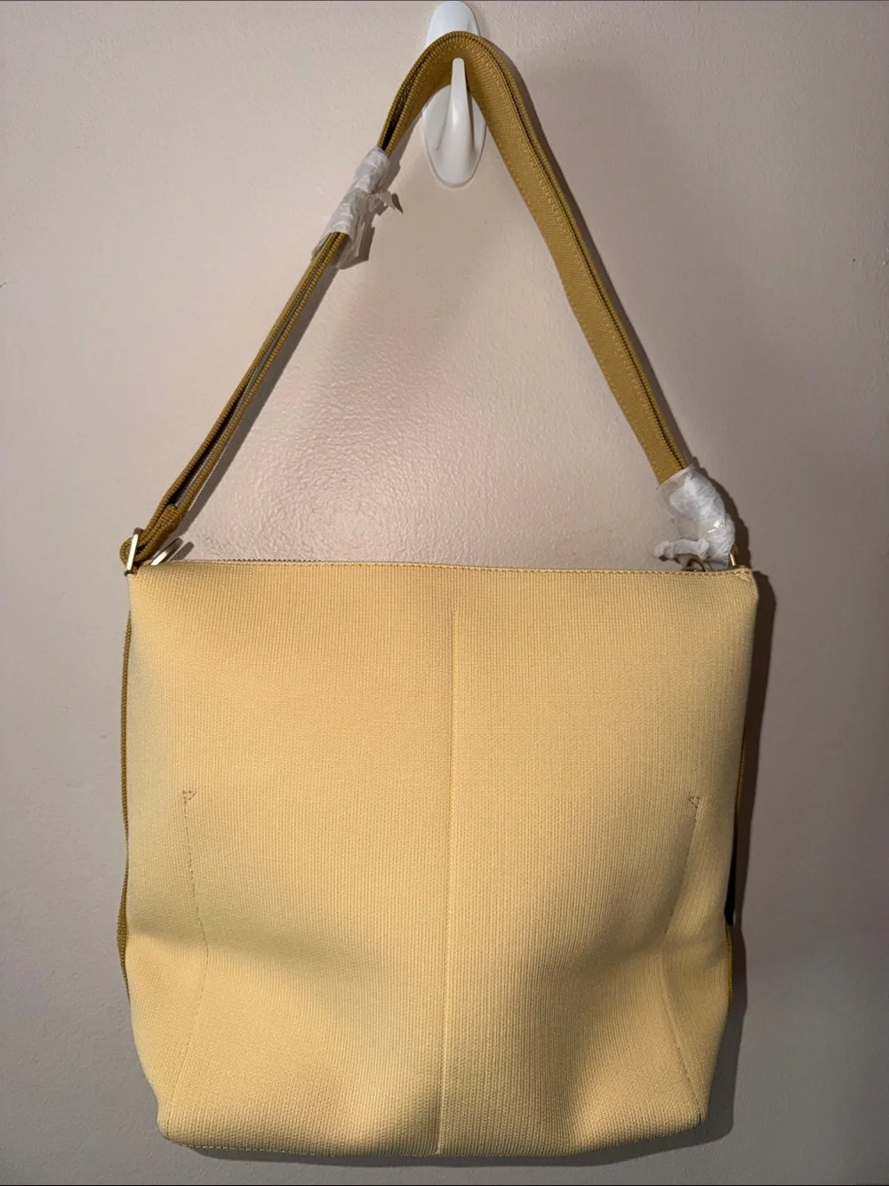 Rothy’s The Mini Zip Bucket Bag in Golden Wheat